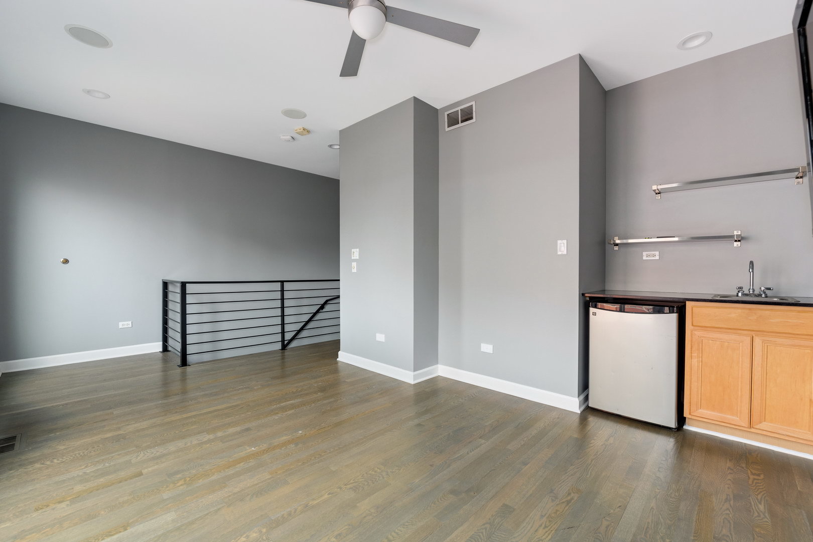18 North Ada Street, Unit C Chicago, IL 60607 - Photo 24 of 28 wooden floor in an empty room with a window