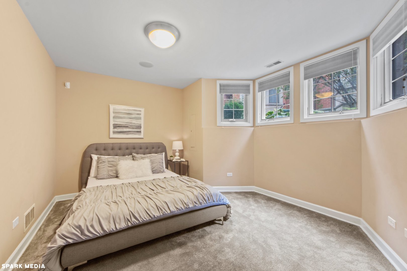 18 North Ada Street, Unit C Chicago, IL 60607 - Photo 27 of 28 a bedroom with a bed and a night stand