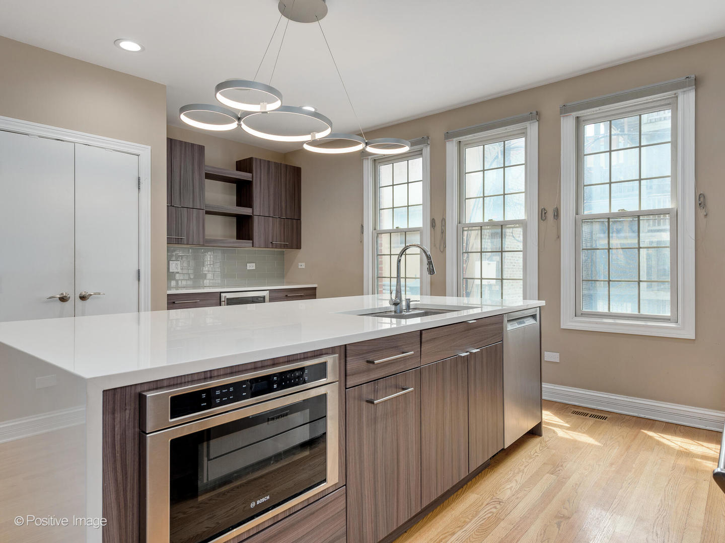 18 North Ada Street, Unit C Chicago, IL 60607 - Photo 9 of 28 a kitchen with a sink and a stove top oven