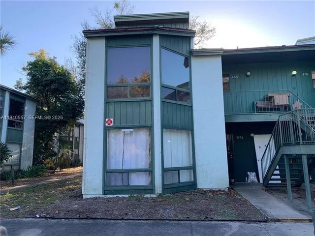 a view of a wooden door of the house