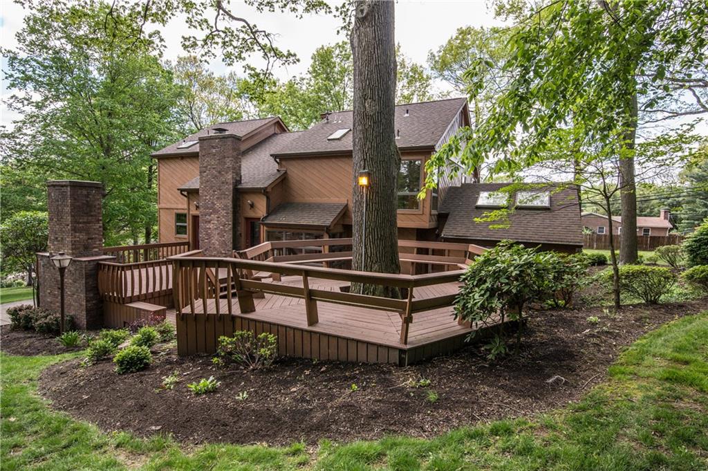 475 Sharon Road Moon Township, PA 15108 - Photo 22 of 25 The deck includes a 16x16 sitting area built around one of the mature trees.