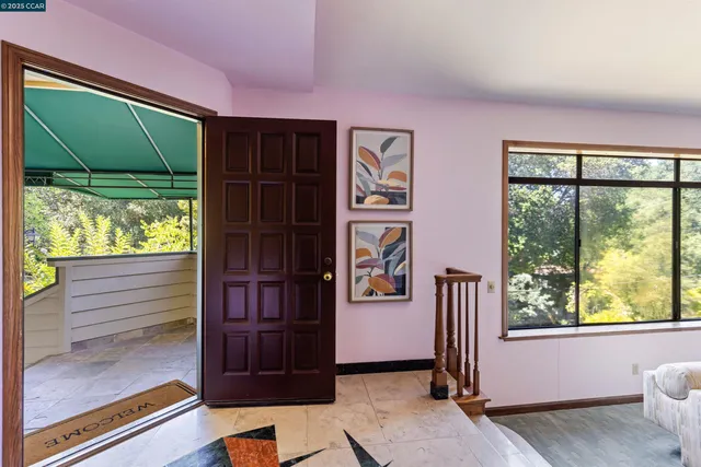 a kitchen with granite countertop a sink and a refrigerator