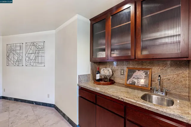 a living room with furniture a flat screen tv and a table
