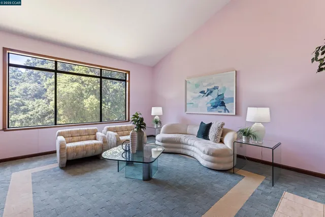 a spacious bedroom with a bed and a window