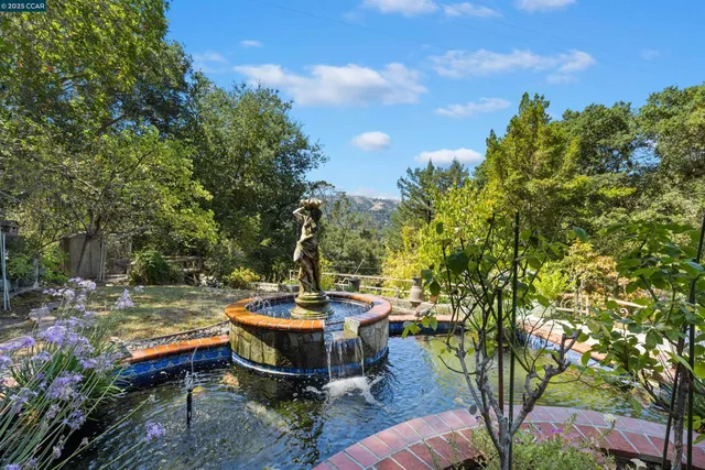 a kitchen with granite countertop stainless steel appliances and wooden cabinets