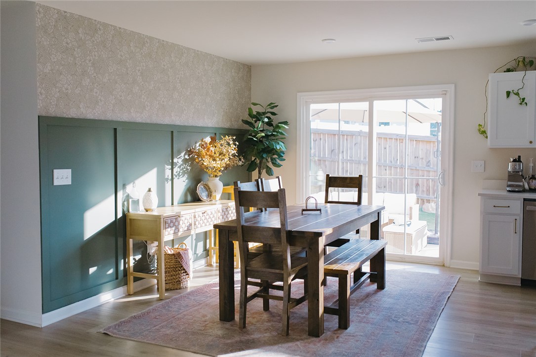 314 Callie Way Easley, SC 29642 - Photo 19 of 27 This bright dining area features an accent wall and sliding glass doors, perfect for gatherings.