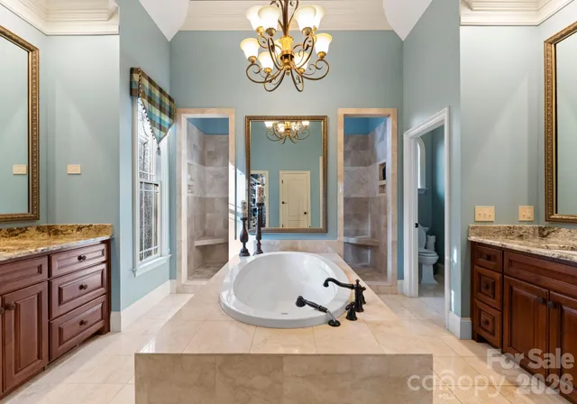 a bathroom with a sink a mirror and a shower