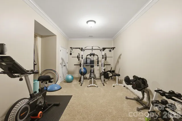 a room with pool table and windows