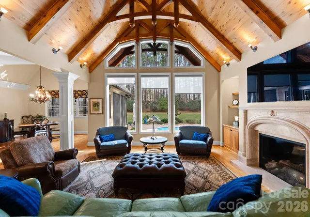 a bedroom with furniture and a fireplace