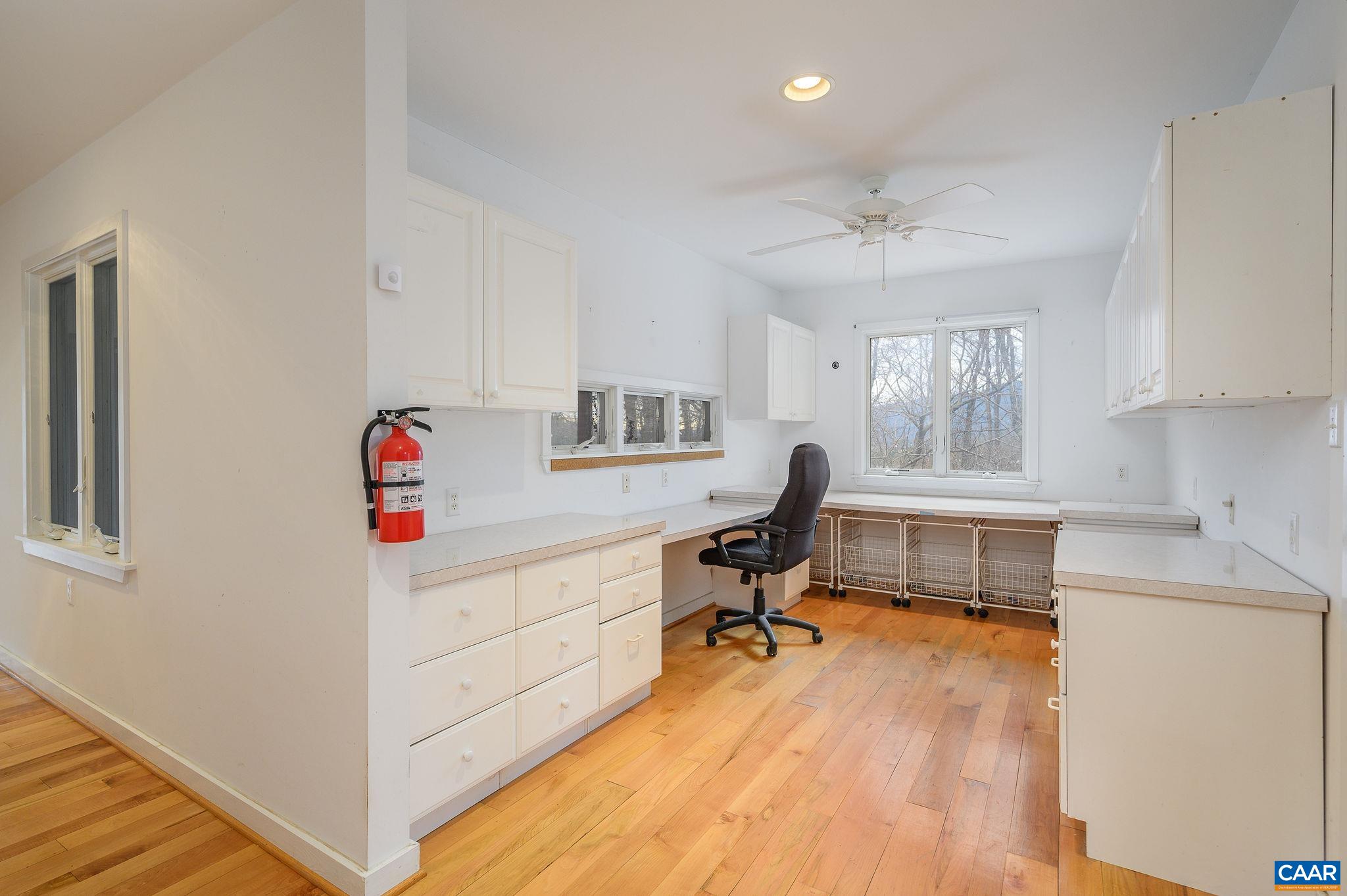9165 Dick Woods Road Afton, VA 22920 - Photo 22 of 56 a view of a workspace with furniture and a dresser