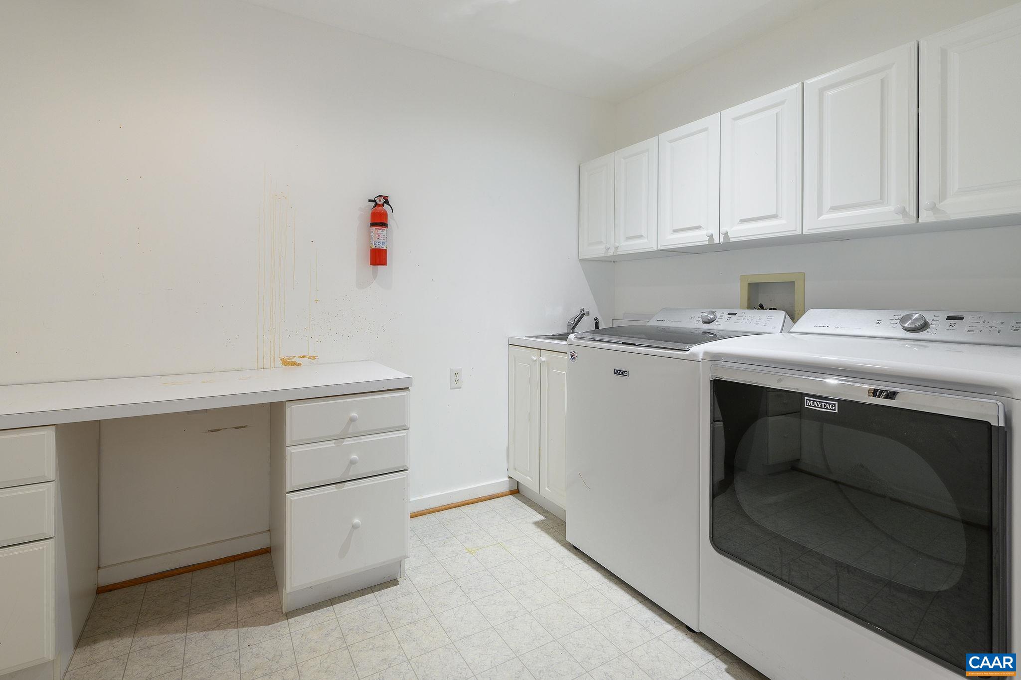 9165 Dick Woods Road Afton, VA 22920 - Photo 23 of 56 a utility room with sink dryer and washer