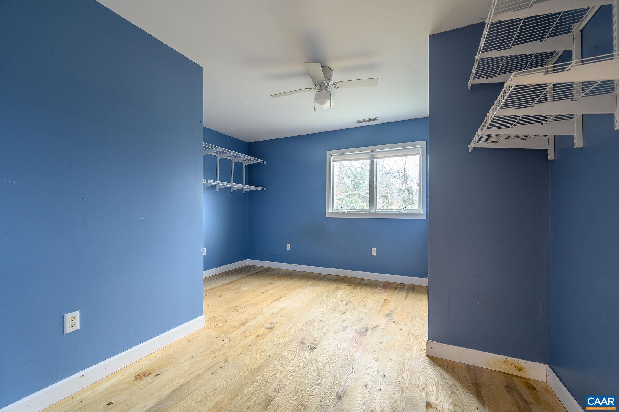 9165 Dick Woods Road Afton, VA 22920 - Photo 38 of 56 a view of an empty room with wooden floor and windows