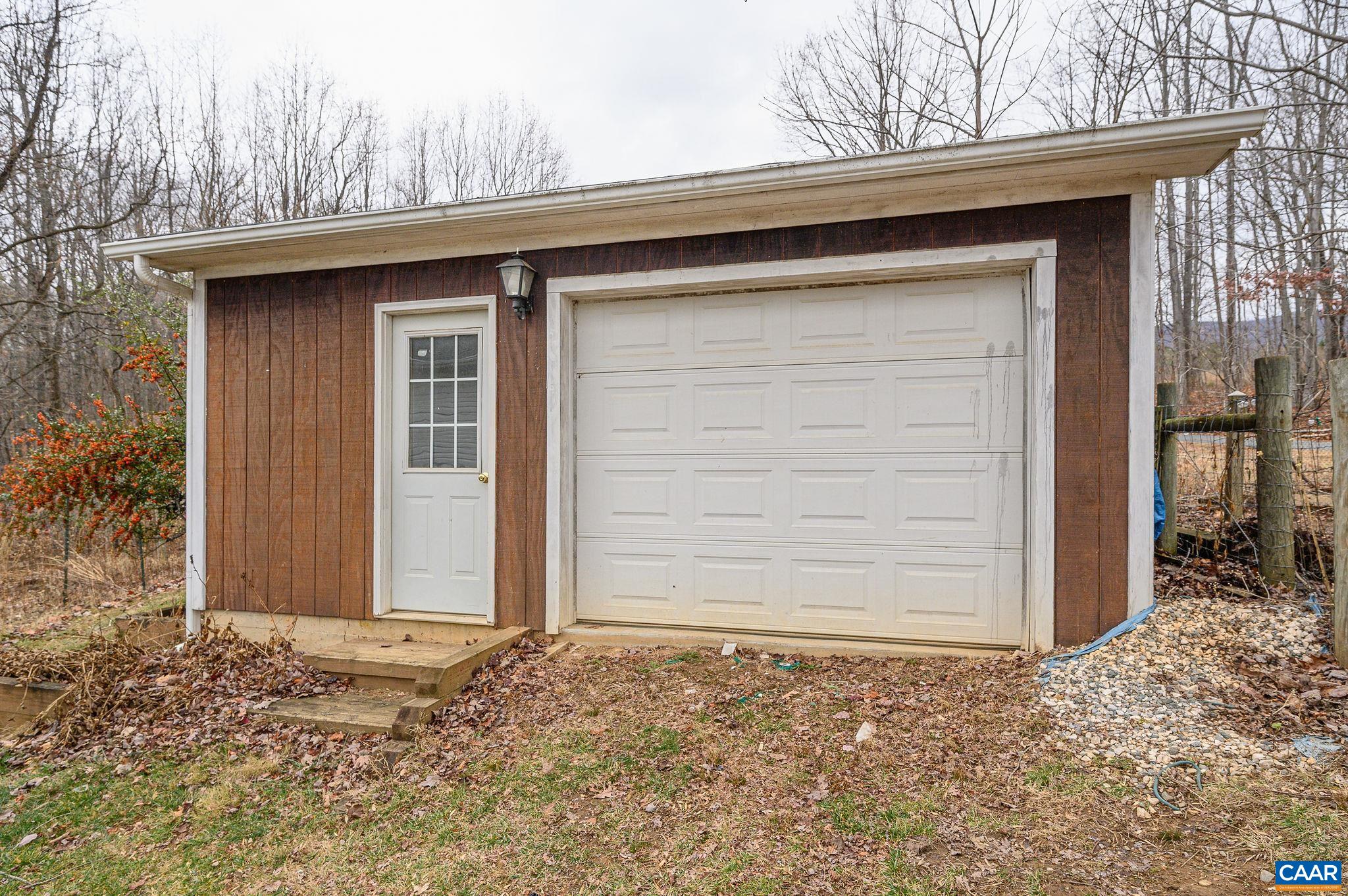 9165 Dick Woods Road Afton, VA 22920 - Photo 42 of 56 a side view of a house with a wooden fence