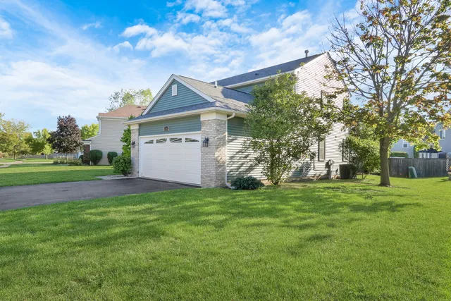 front view of a house with a yard