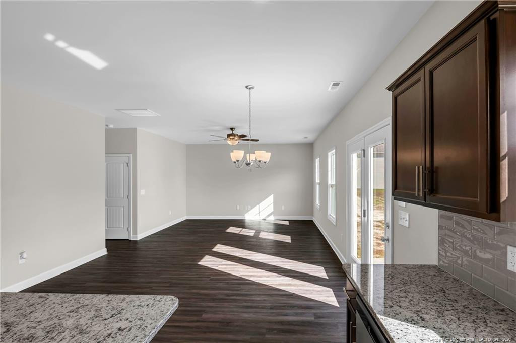 64 Onslow Court Spring Lake, NC 28390 - Photo 14 of 37 a view of a livingroom with furniture wooden floor and a carpet