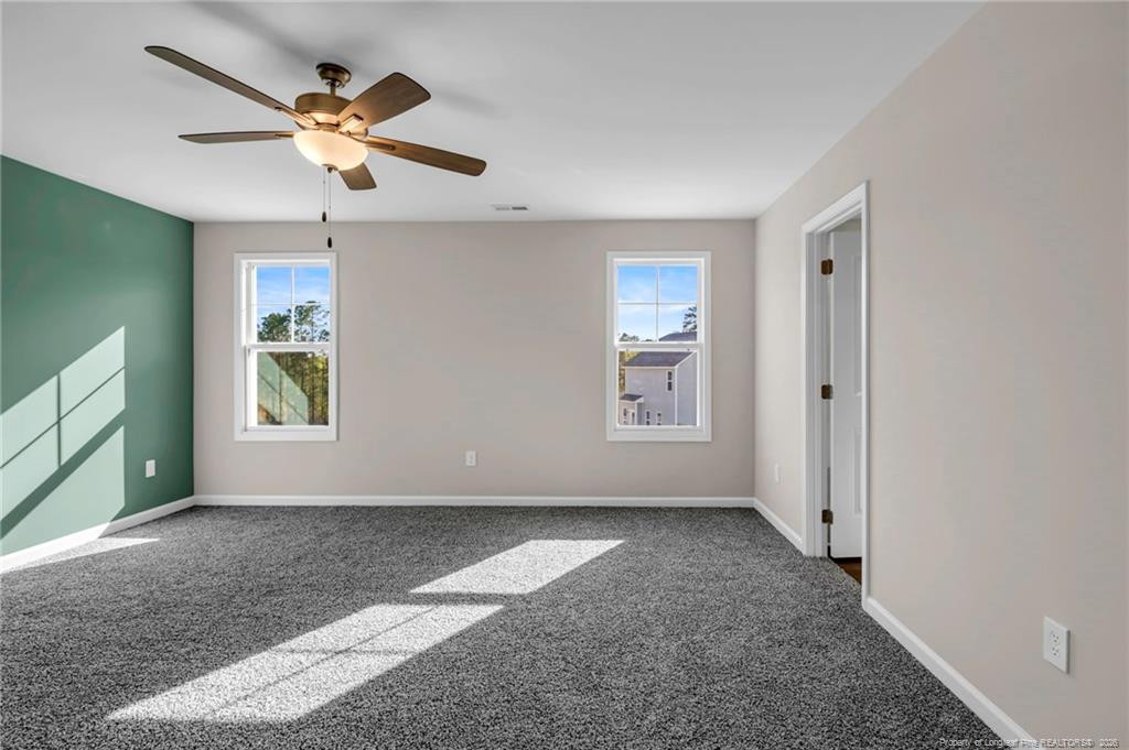 64 Onslow Court Spring Lake, NC 28390 - Photo 16 of 37 an empty room with windows and fan