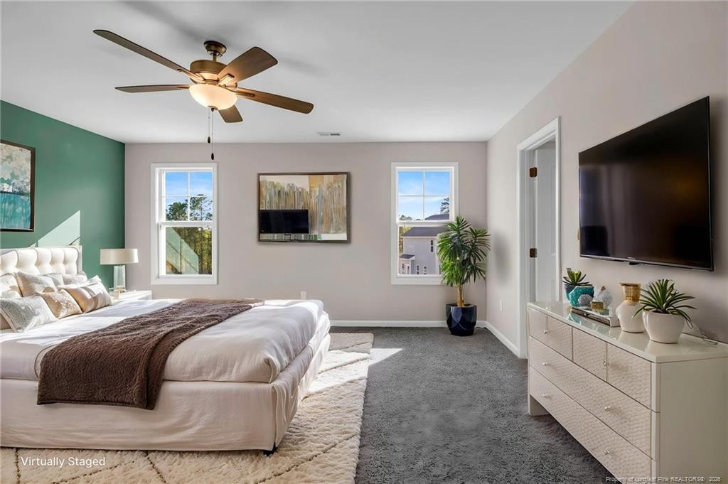 64 Onslow Court Spring Lake, NC 28390 - Photo 18 of 37 a bedroom with a bed and a flat screen tv