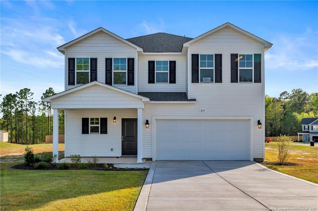 64 Onslow Court Spring Lake, NC 28390 - Photo 2 of 37 a front view of a house with a yard