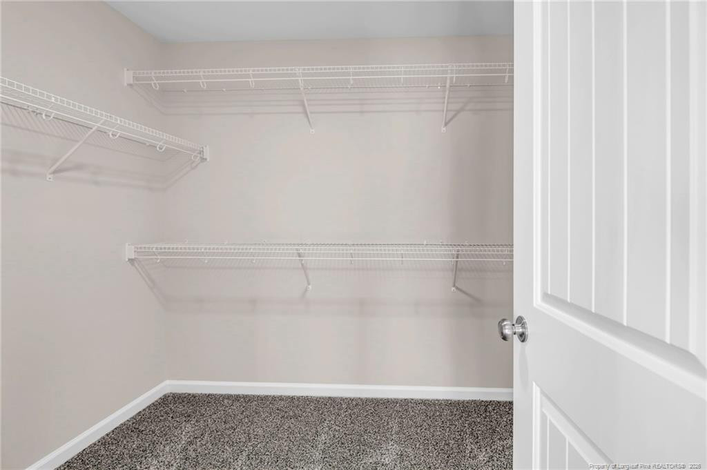 64 Onslow Court Spring Lake, NC 28390 - Photo 21 of 37 a view of a room with racks on the wall