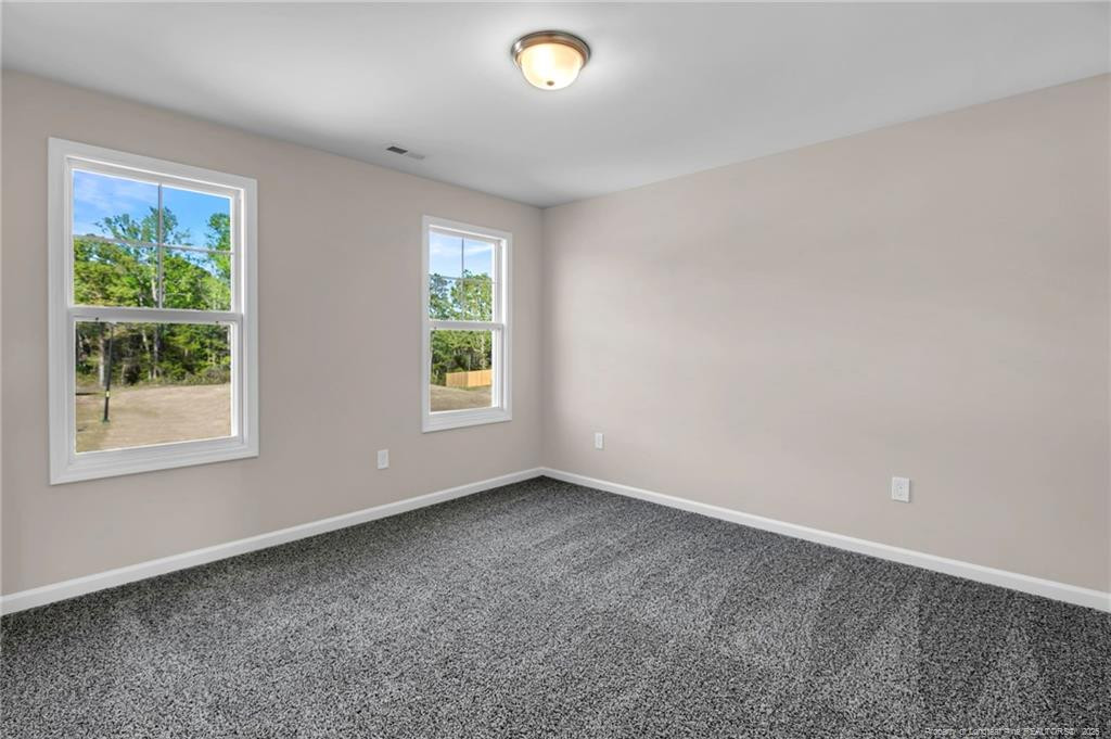 64 Onslow Court Spring Lake, NC 28390 - Photo 24 of 37 a view of an empty room with a window