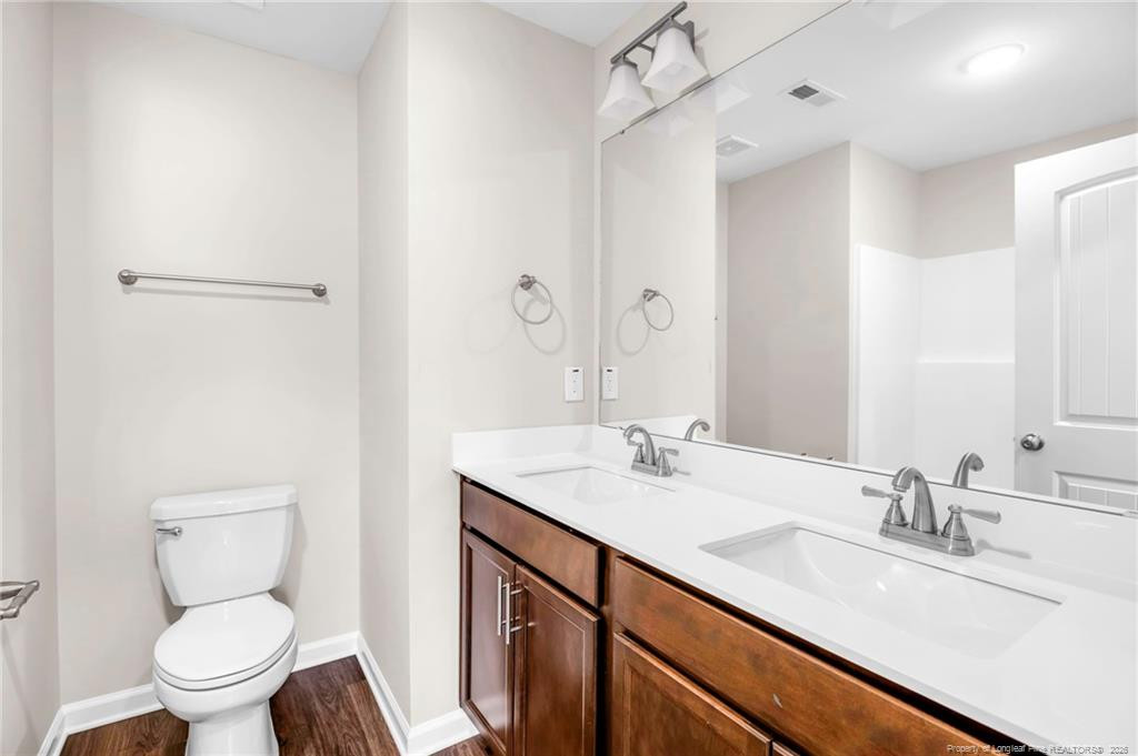 64 Onslow Court Spring Lake, NC 28390 - Photo 27 of 37 a bathroom with a sink toilet and shower