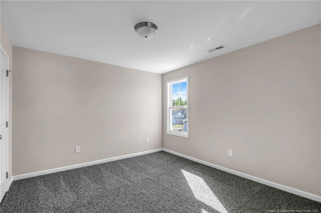 64 Onslow Court Spring Lake, NC 28390 - Photo 29 of 37 a view of an empty room with a window
