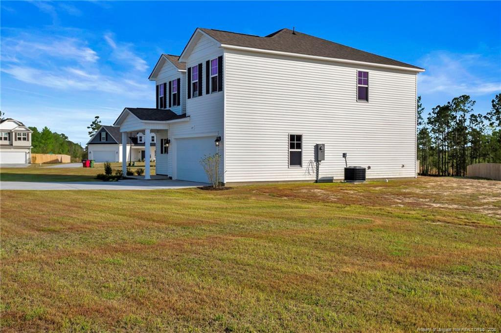 64 Onslow Court Spring Lake, NC 28390 - Photo 36 of 37 a view of a house with a swimming pool