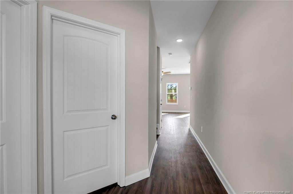 64 Onslow Court Spring Lake, NC 28390 - Photo 4 of 37 a view of a hallway with wooden floor