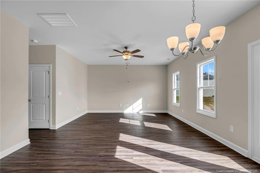 64 Onslow Court Spring Lake, NC 28390 - Photo 8 of 37 a view of a room with wooden floor and chandelier
