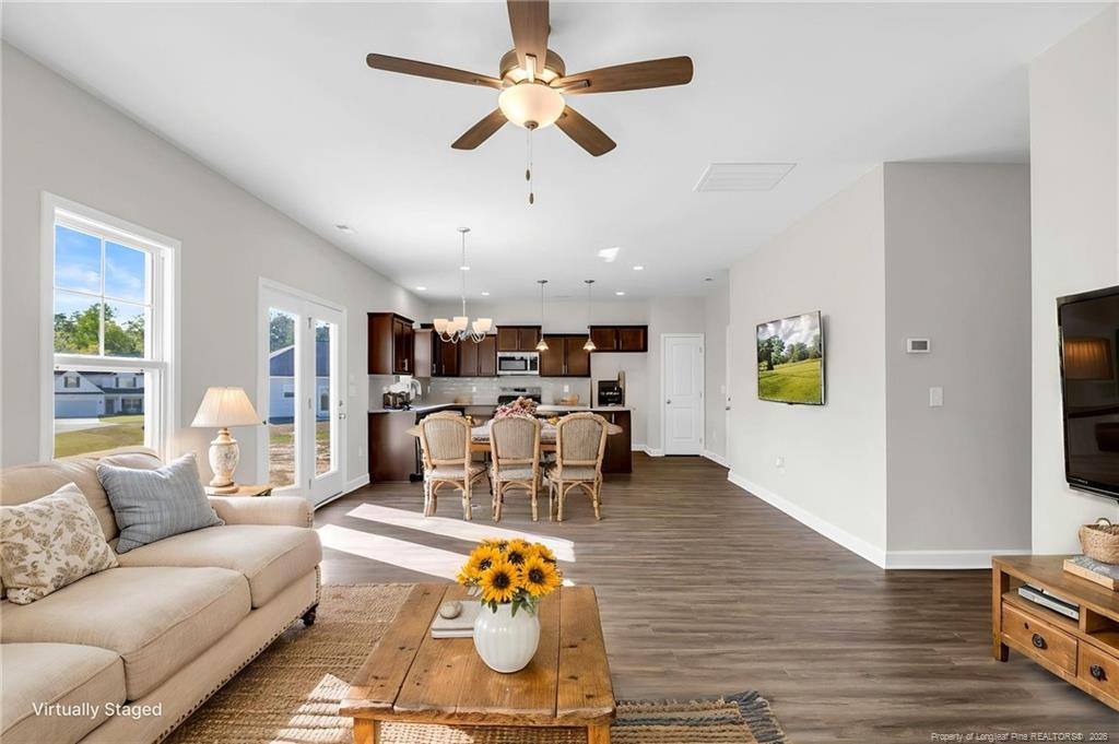 64 Onslow Court Spring Lake, NC 28390 - Photo 10 of 37 a living room with furniture and a wooden floor