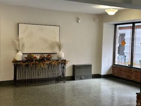 a view of a porch with furniture and front door