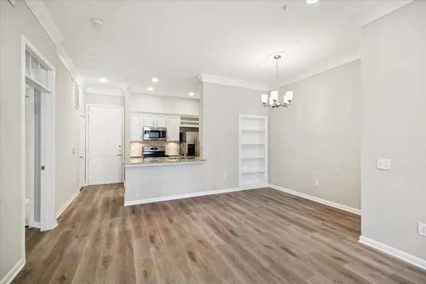 a view of kitchen with wooden floor and window