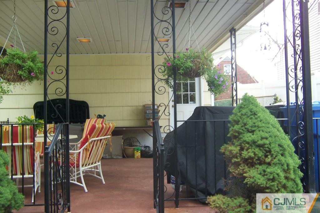 35 Hillcrest Road Colonia, NJ 07067 - Photo 15 of 17 a view of balcony with outdoor seating and plants