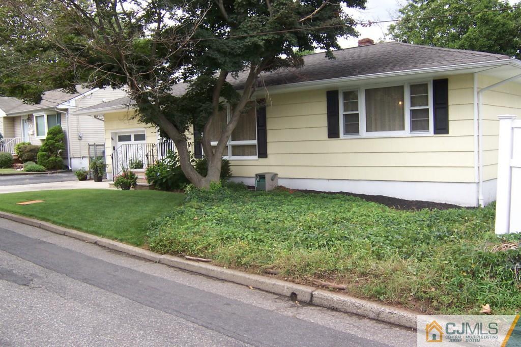 35 Hillcrest Road Colonia, NJ 07067 - Photo 17 of 17 a front view of a house with a yard