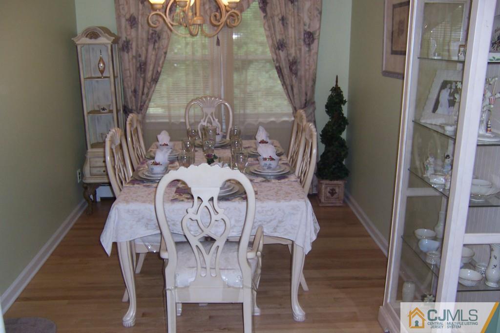 35 Hillcrest Road Colonia, NJ 07067 - Photo 4 of 17 a view of a dining room with furniture and wooden floor