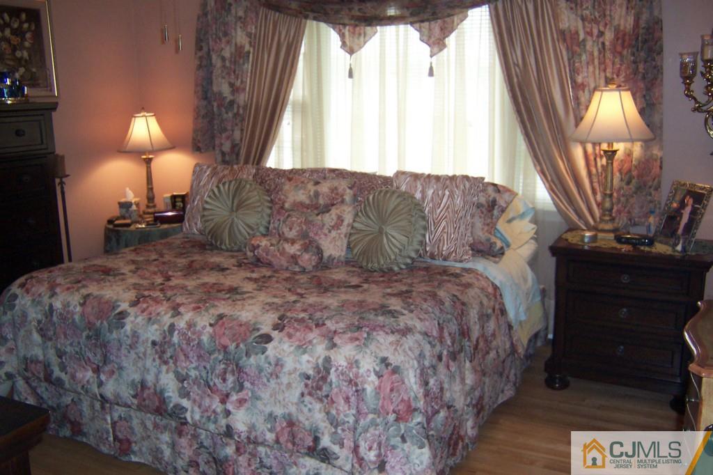 35 Hillcrest Road Colonia, NJ 07067 - Photo 8 of 17 a bed sitting in a bedroom next to a window