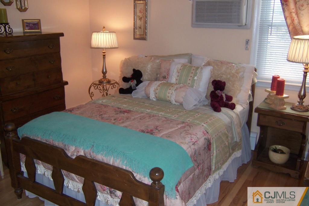 35 Hillcrest Road Colonia, NJ 07067 - Photo 9 of 17 a bed sitting in a bedroom next to a window