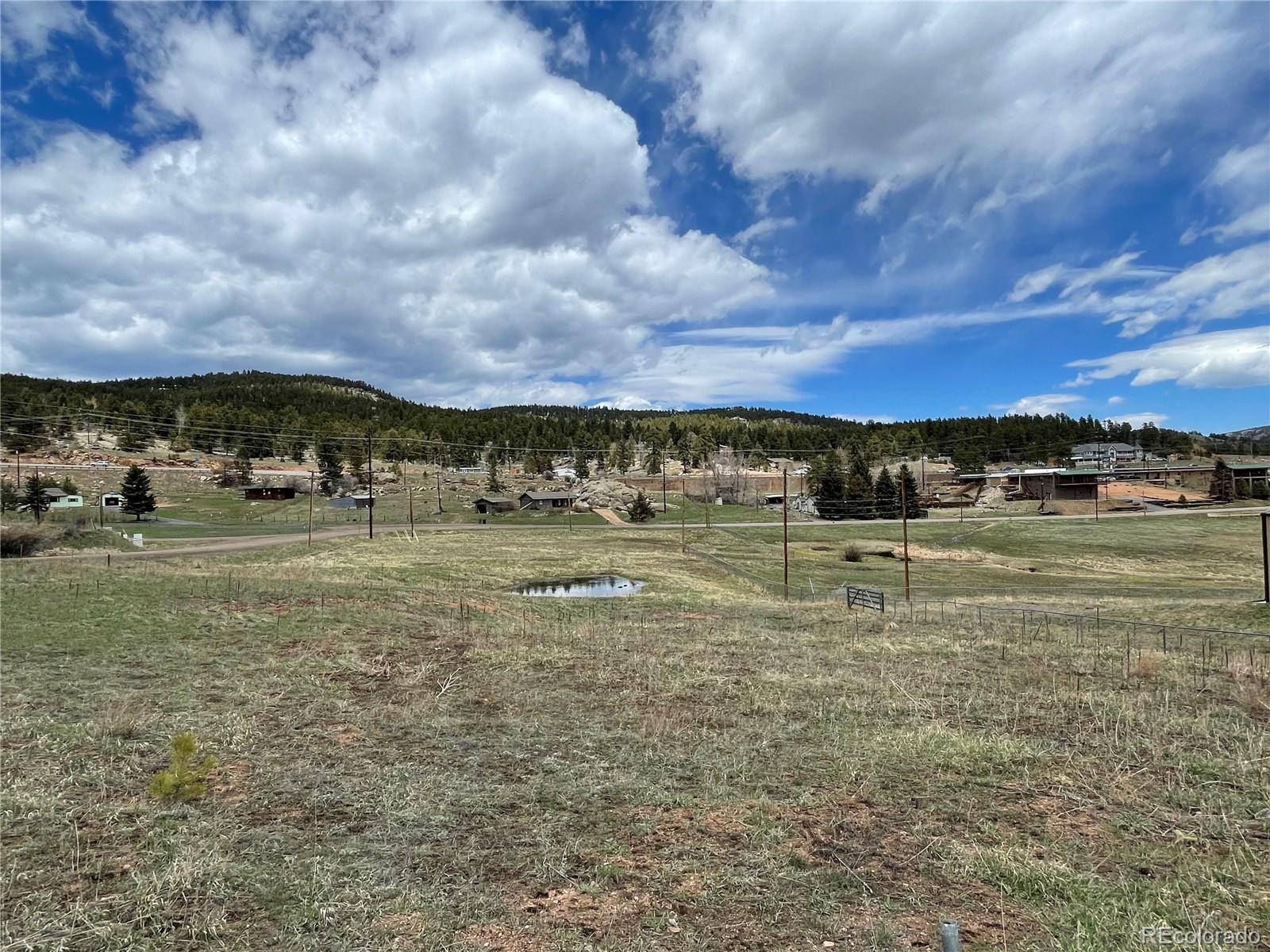 28652 Doe Valley Drive Conifer, CO 80433 - Photo 11 of 13 a view of a lake with houses
