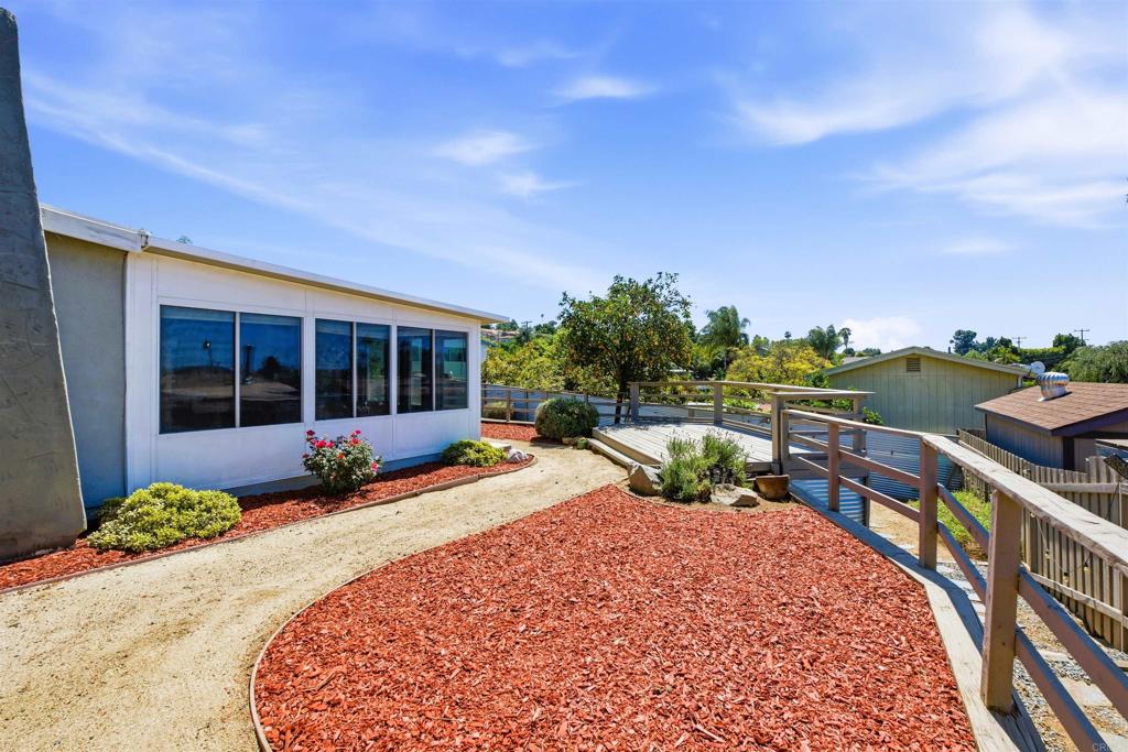 421 Hillcrest Lane Fallbrook, CA 92028 - Photo 25 of 32 a view of a house with backyard sitting area and roof