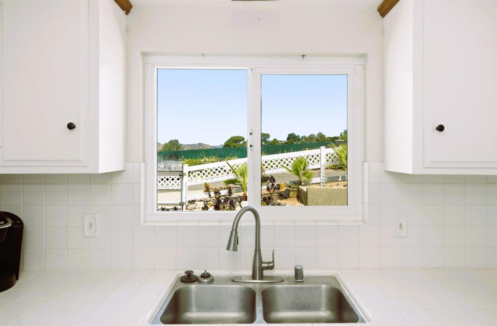 421 Hillcrest Lane Fallbrook, CA 92028 - Photo 6 of 32 a bathroom with a sink and a large window