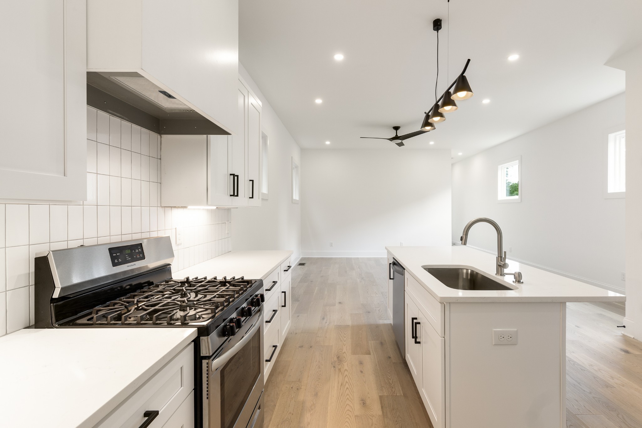 2012 Owen Street, Unit A Nashville, TN 37208 - Photo 11 of 32 a kitchen with granite countertop a stove and a sink