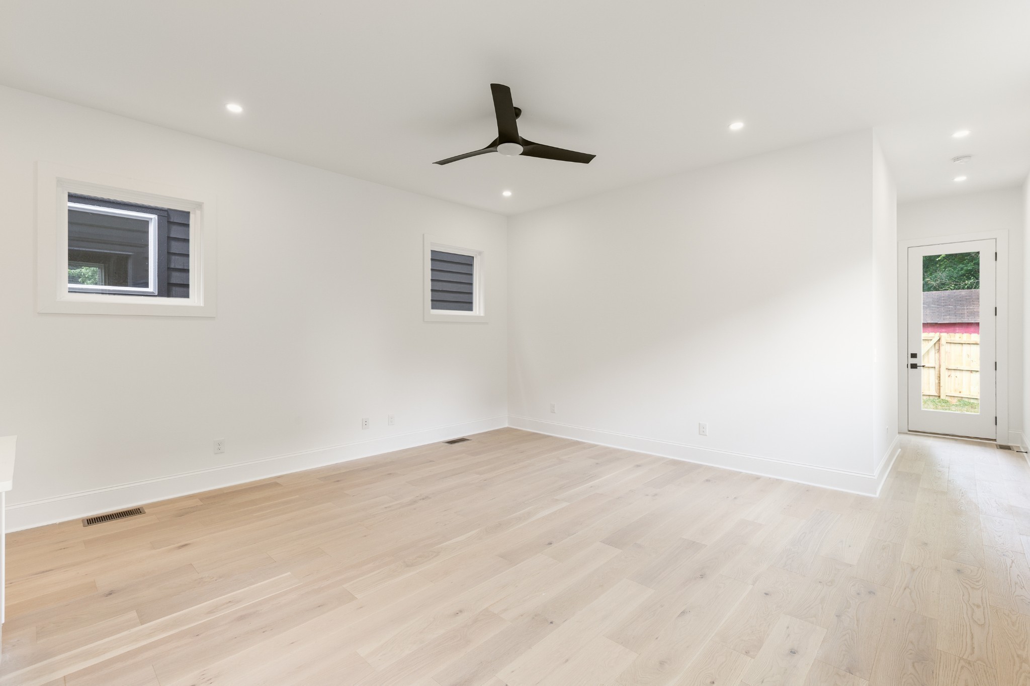 2012 Owen Street, Unit A Nashville, TN 37208 - Photo 13 of 32 an empty room with windows and cabinet