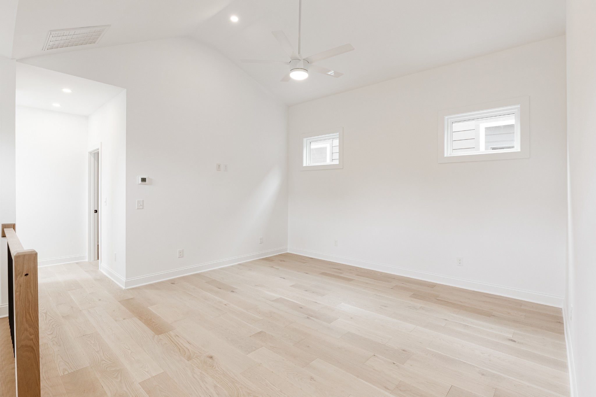 2012 Owen Street, Unit A Nashville, TN 37208 - Photo 19 of 32 a view of an empty room with wooden floor and a window