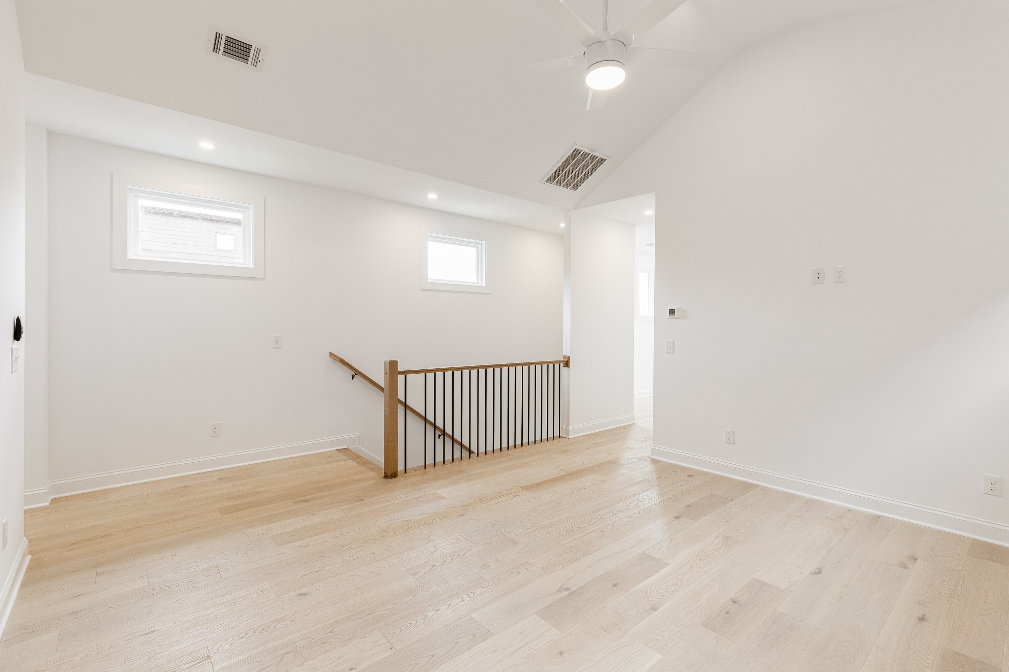 2012 Owen Street, Unit A Nashville, TN 37208 - Photo 20 of 32 an empty room with staircase and windows