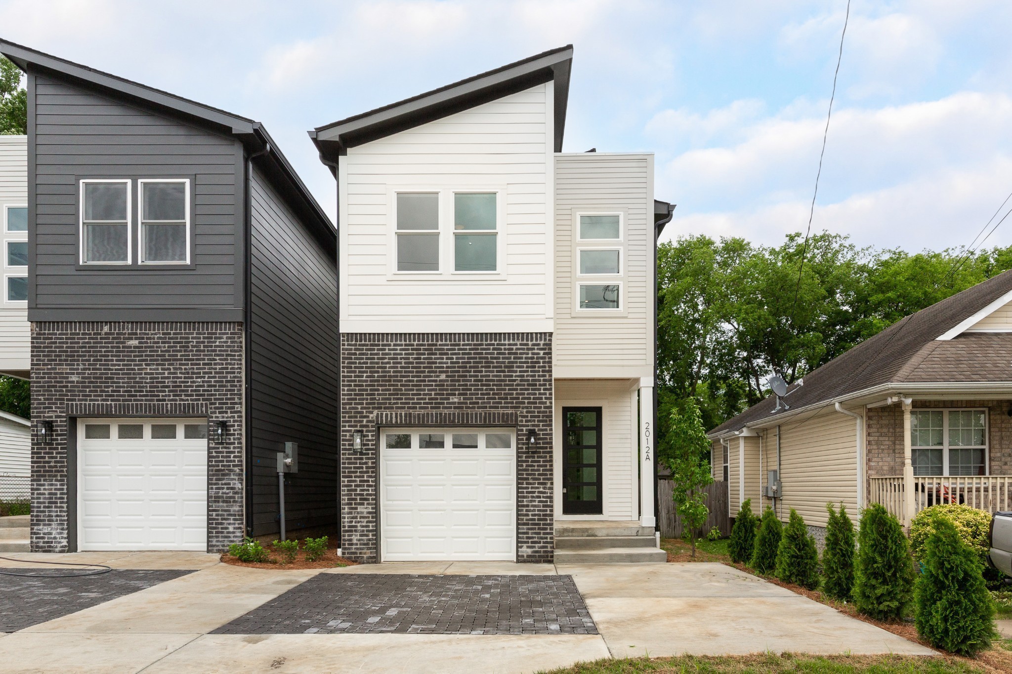 2012 Owen Street, Unit A Nashville, TN 37208 - Photo 2 of 32 a front view of a house with a yard