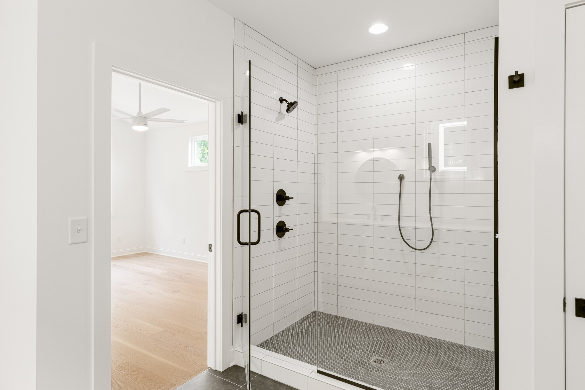 2012 Owen Street, Unit A Nashville, TN 37208 - Photo 25 of 32 a bathroom with a glass shower door