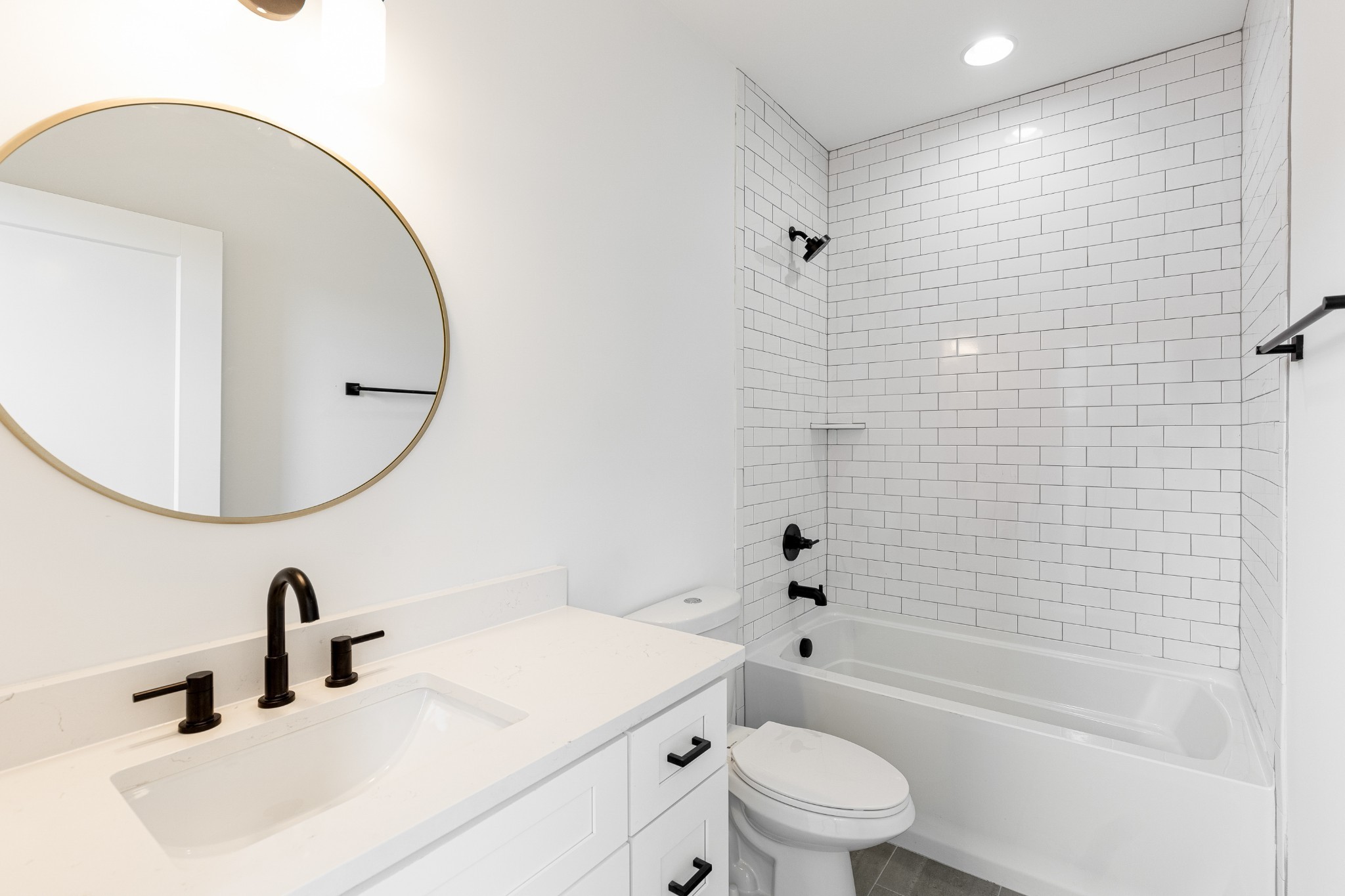 2012 Owen Street, Unit A Nashville, TN 37208 - Photo 28 of 32 a bathroom with a sink a toilet and a mirror