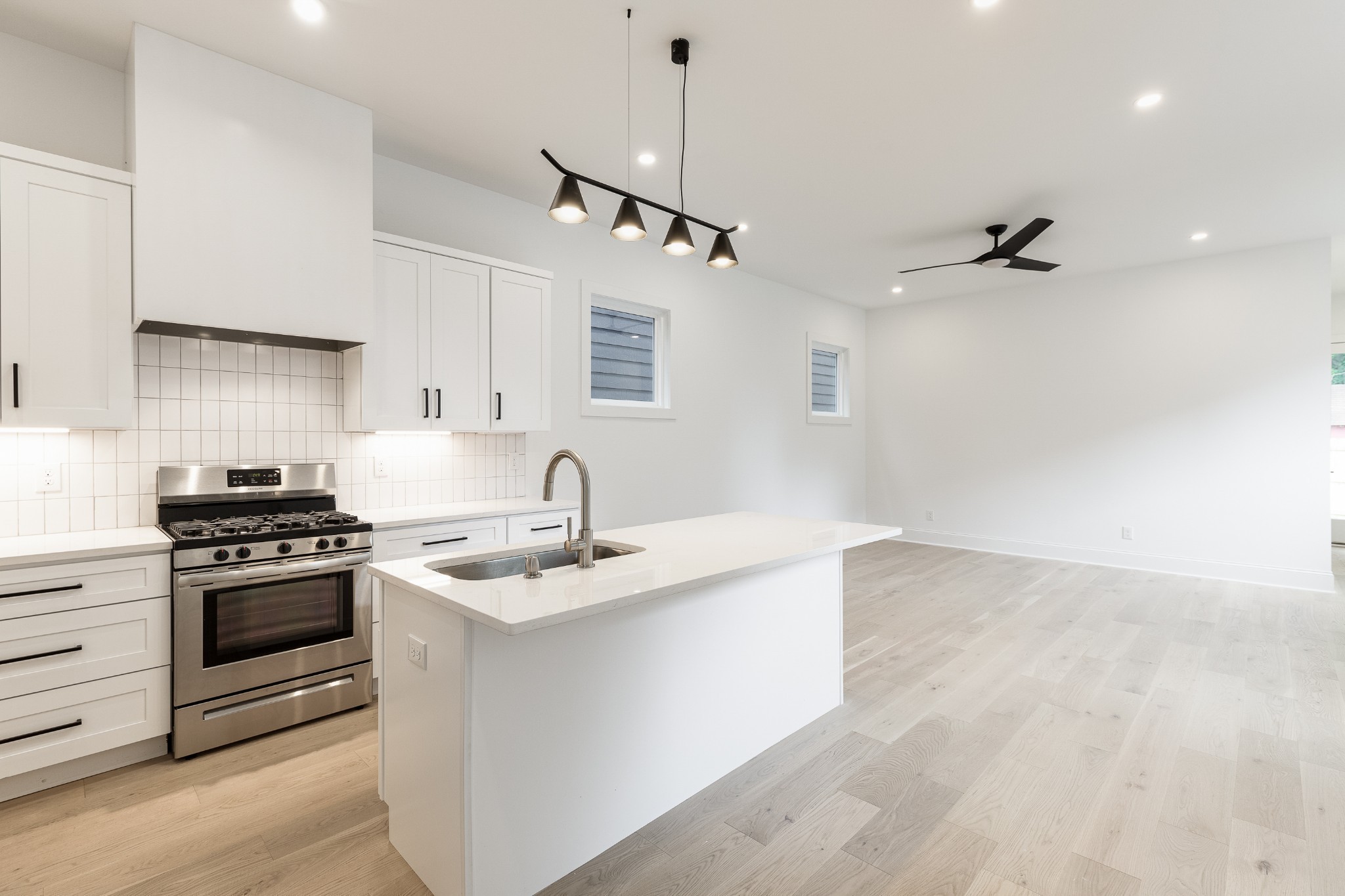 2012 Owen Street, Unit A Nashville, TN 37208 - Photo 6 of 32 a kitchen with stainless steel appliances granite countertop a sink a stove and a refrigerator