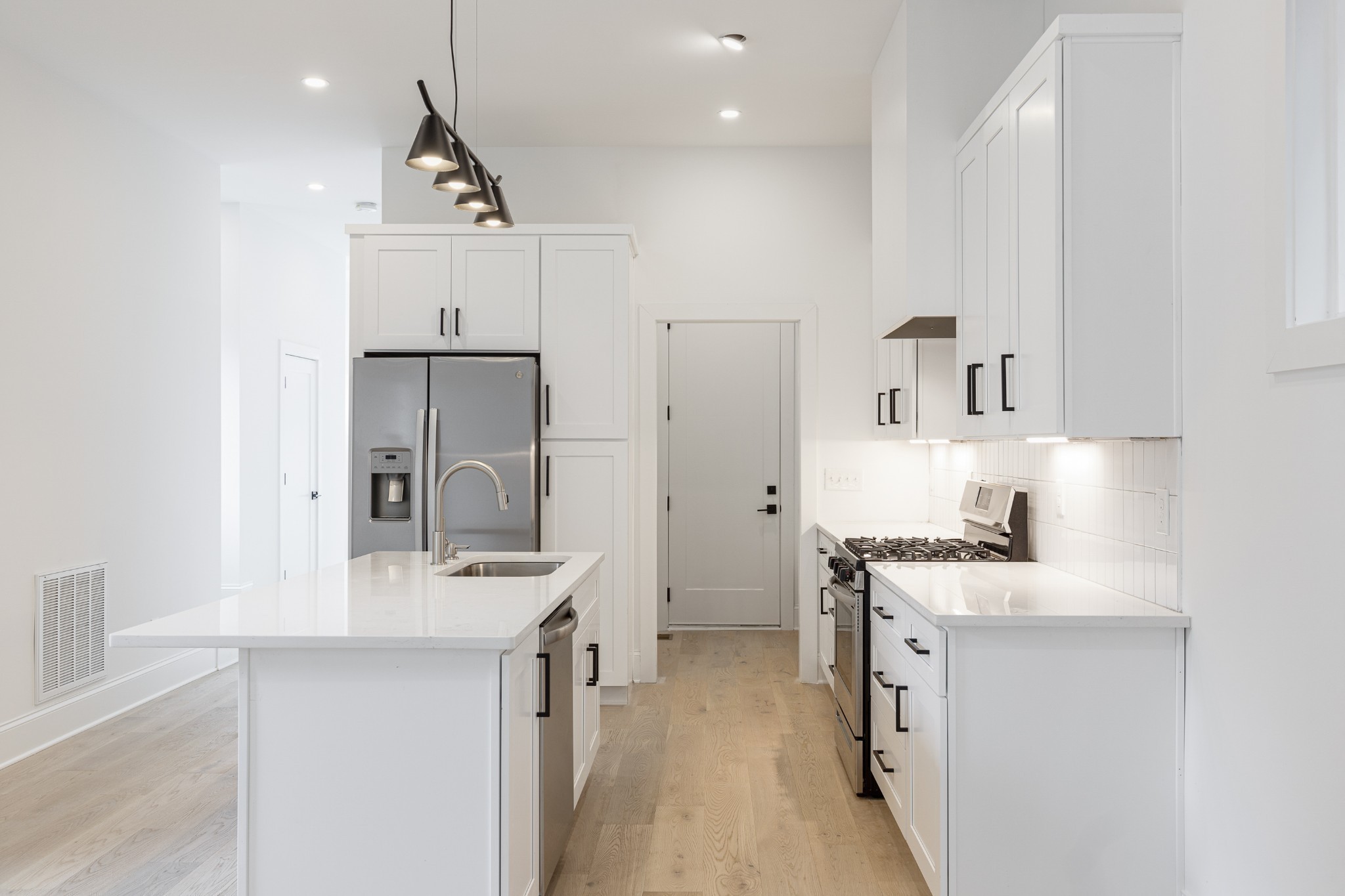 2012 Owen Street, Unit A Nashville, TN 37208 - Photo 8 of 32 a kitchen with a sink stove and refrigerator