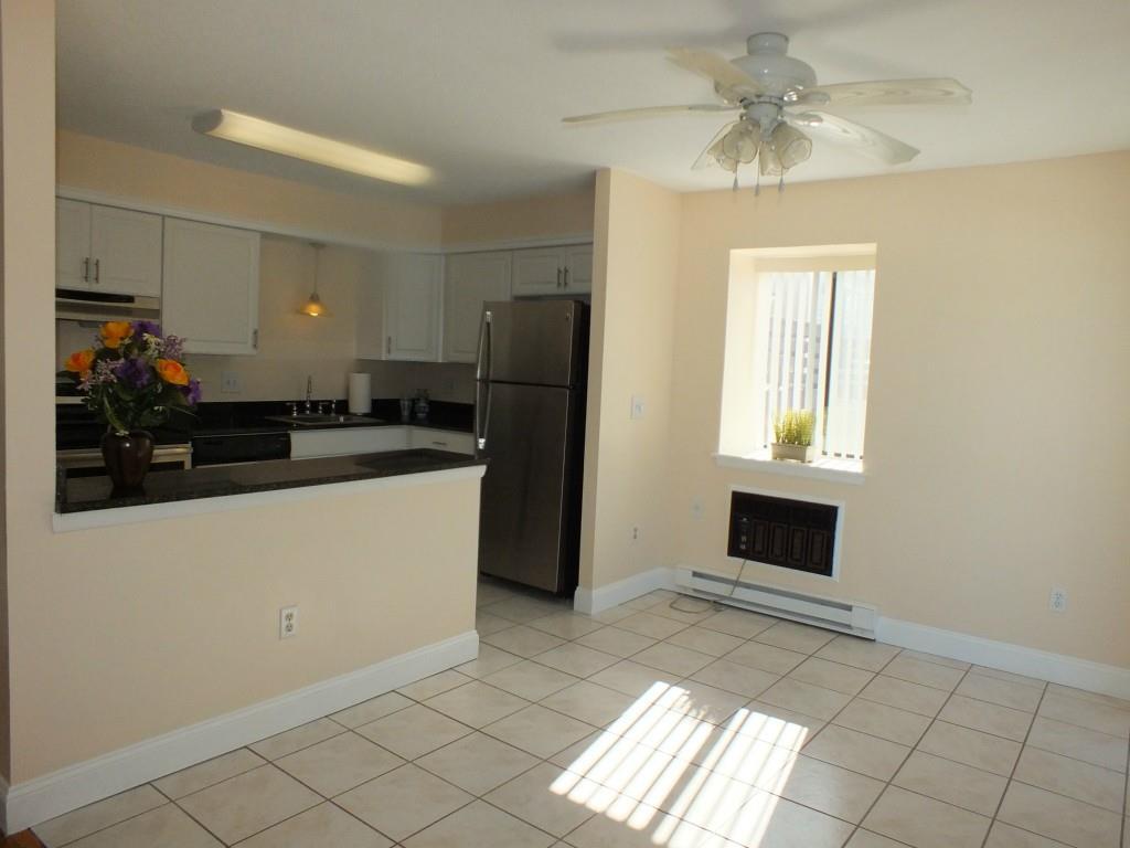 93 Kent Court, Unit 93 Meriden, CT 06450 - Photo 4 of 27 a kitchen with a refrigerator and a sink